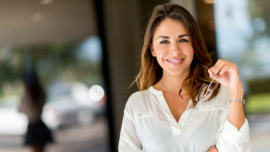 Woman with glasses who has found affordable eye care