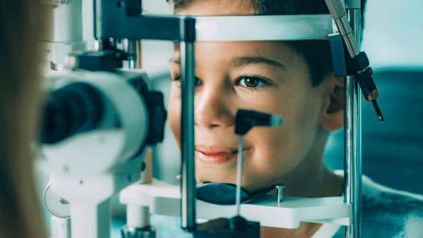 Boy getting an eye exam to determine his level of myopia progression.