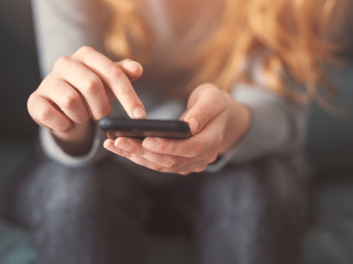 Person On Their Phone