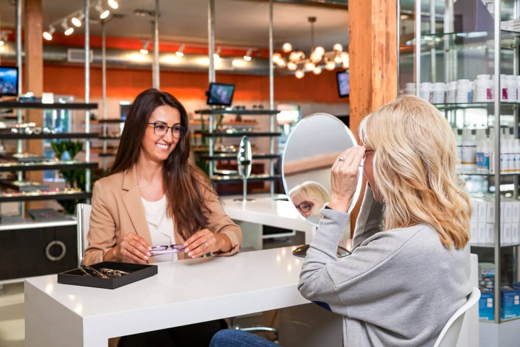 Person shopping for eyewear at Invision Optometry